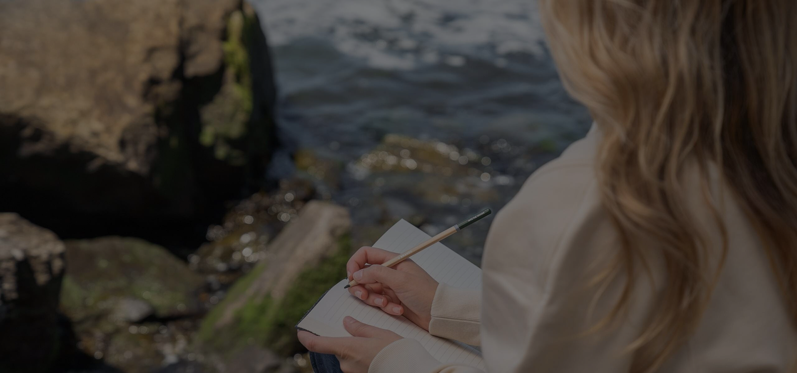 Woman sitting by the ocean - Abigail Mind Body Soul